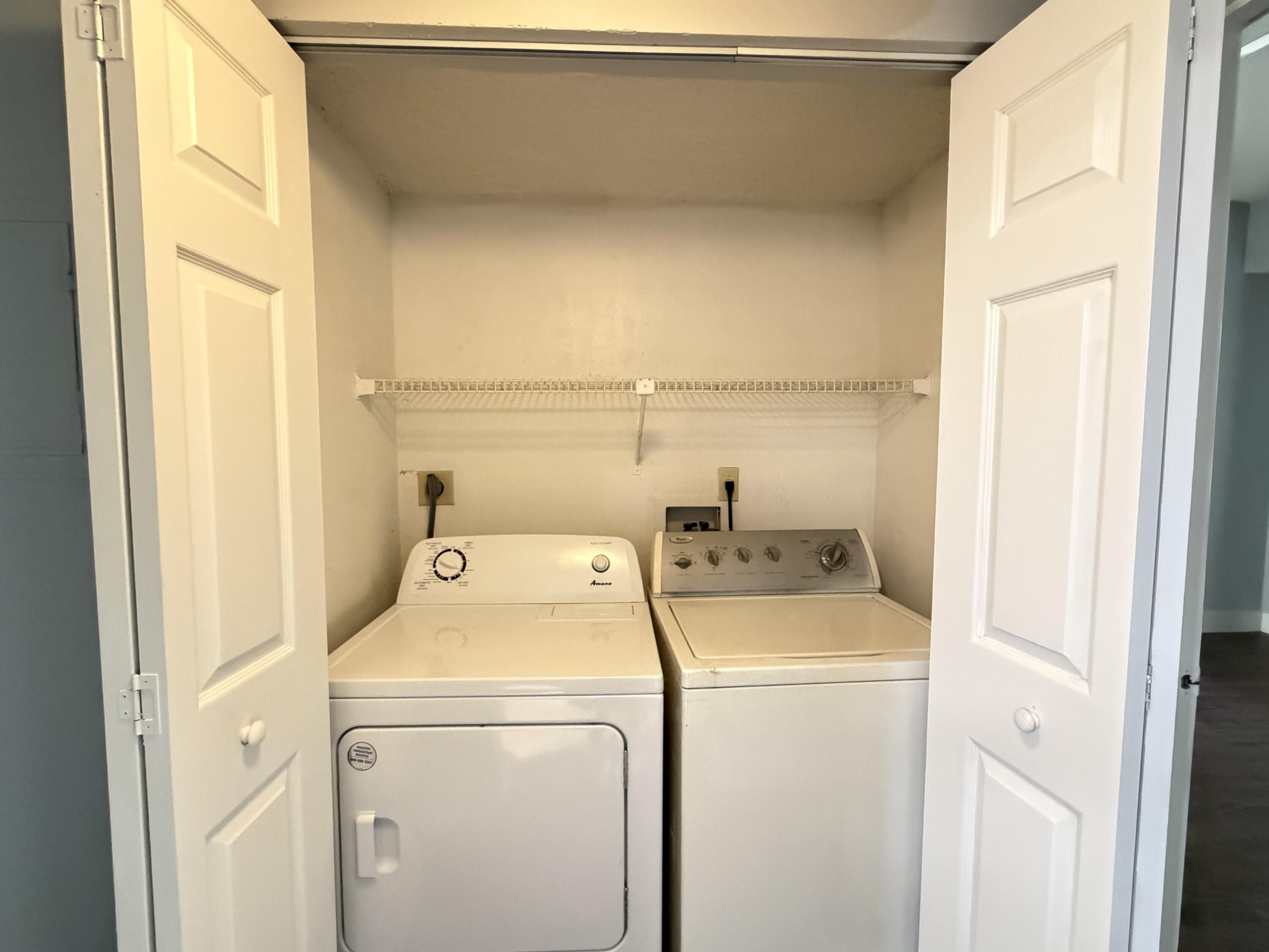 921 Lyons Road, Unit 3205 Coconut Creek, FL 33063 - Photo 14 of 17 a utility room with dryer and washer