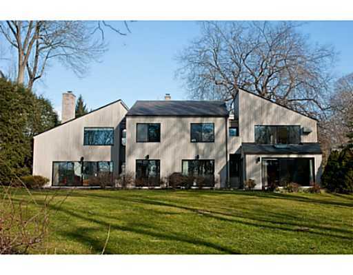 38 Carriglea Drive Riverside, CT 06878 - Photo 1 of 10 a view of a white house with a big yard and potted plants