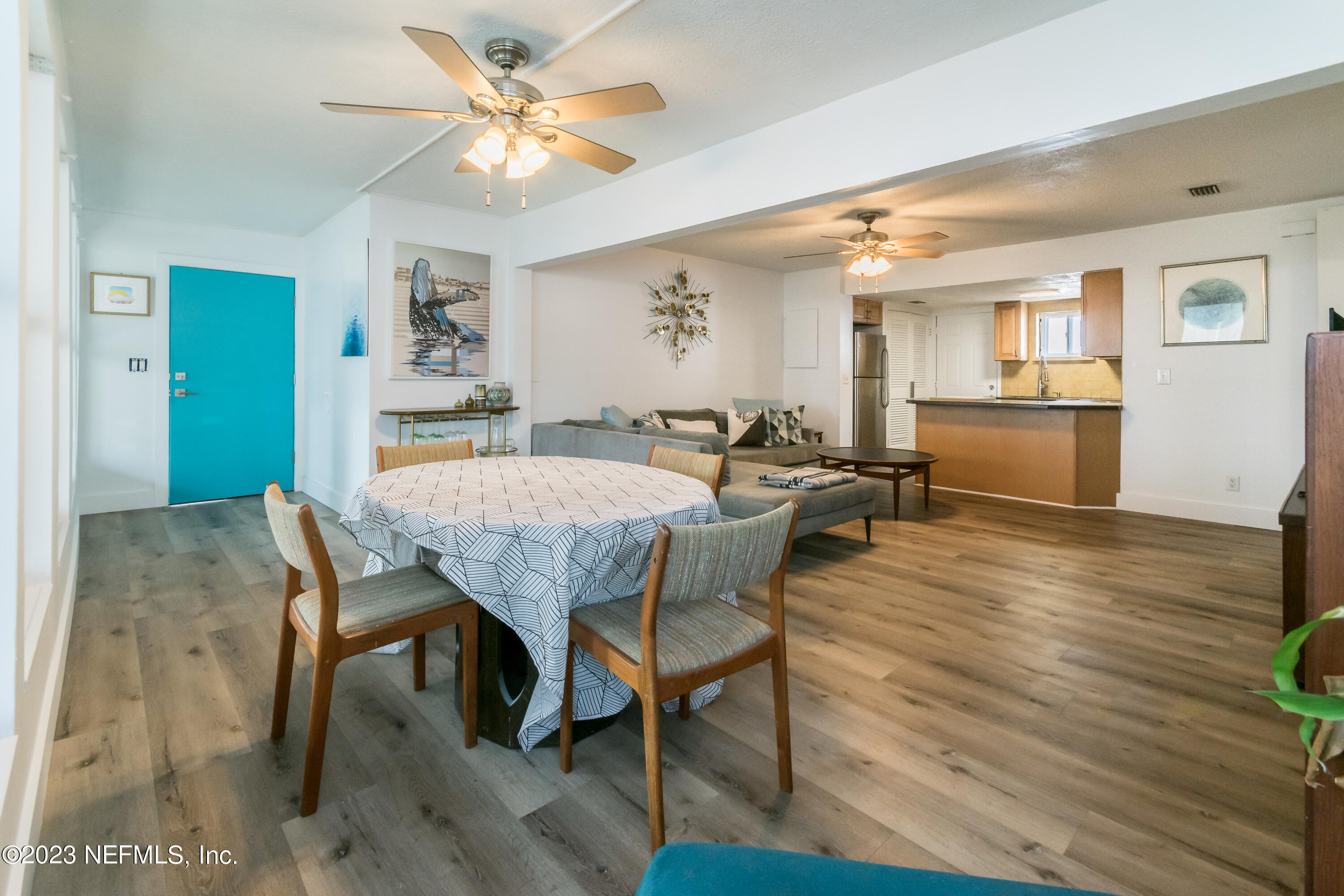 1632 Strand Street Neptune Beach, FL 32266 - Photo 3 of 22 a view of a dining room with furniture and wooden floor