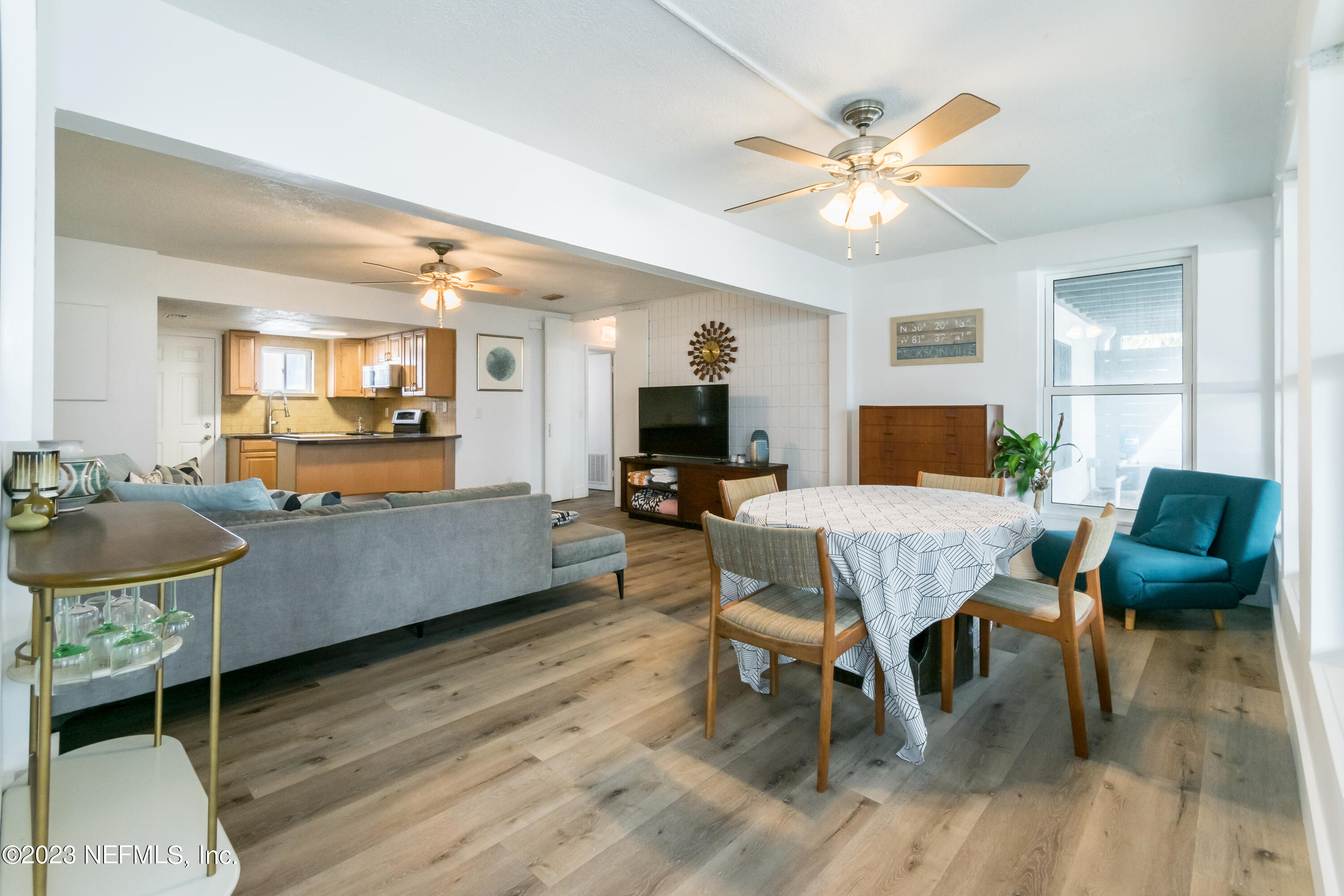 1632 Strand Street Neptune Beach, FL 32266 - Photo 6 of 22 a living room with furniture and a flat screen tv