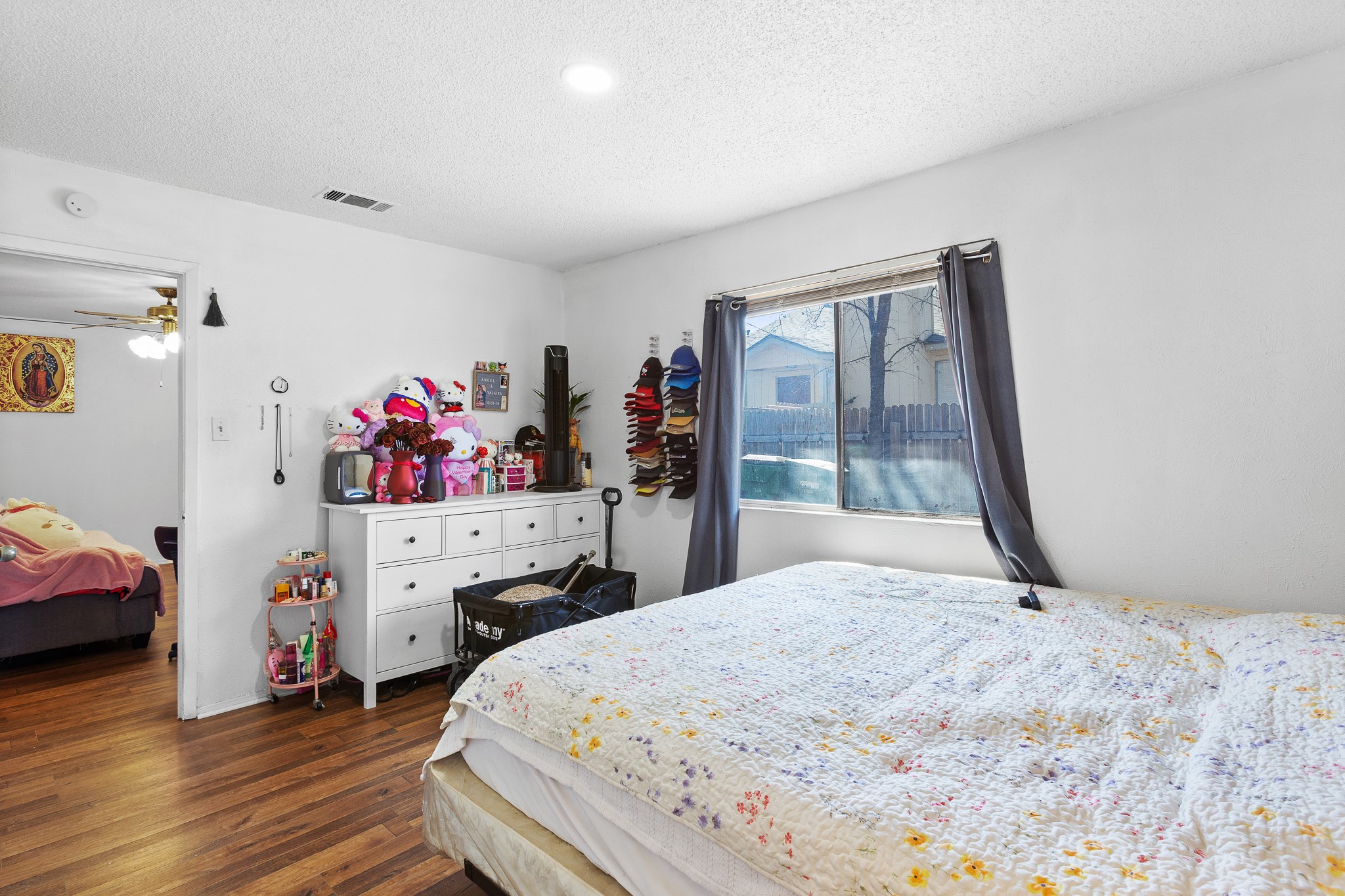 606 Misty Morning Way, Unit A AND B Round Rock, TX 78664 - Photo 15 of 22 Bedroom with dark wood finished floors and a textured ceiling