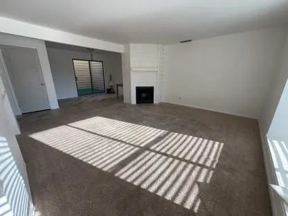 a bedroom with a bed and a fireplace