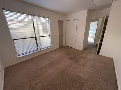 1919 Place Rebecca Lane, Unit H11 Houston, TX 77090 - Photo 9 of 18 an empty room with windows