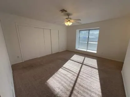 a view of an empty room with a window