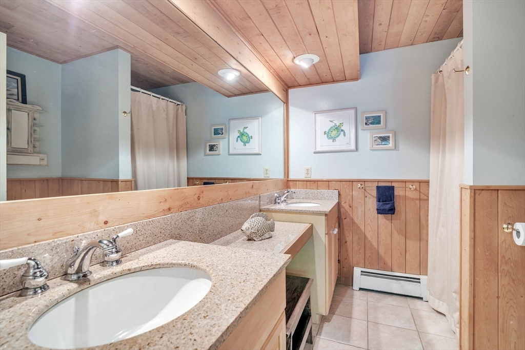 4 Stuart Road Rochester, MA 02770 - Photo 21 of 37 a bathroom with a granite countertop sink and a mirror