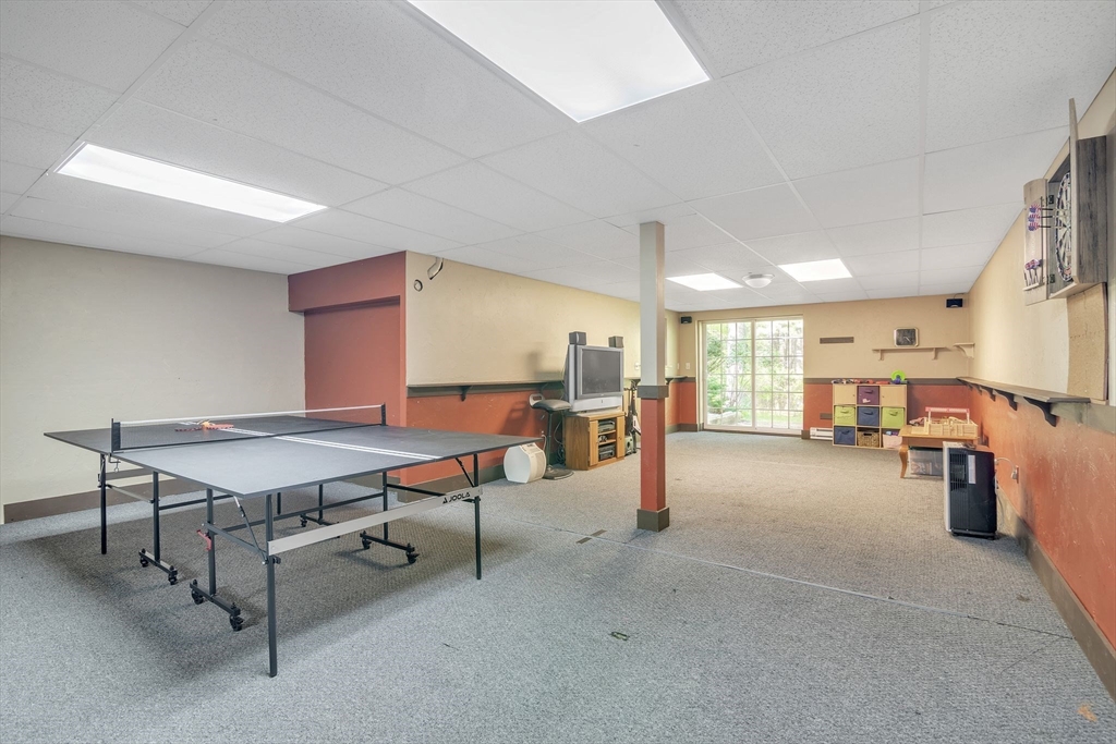 4 Stuart Road Rochester, MA 02770 - Photo 25 of 37 a room with furniture and a table