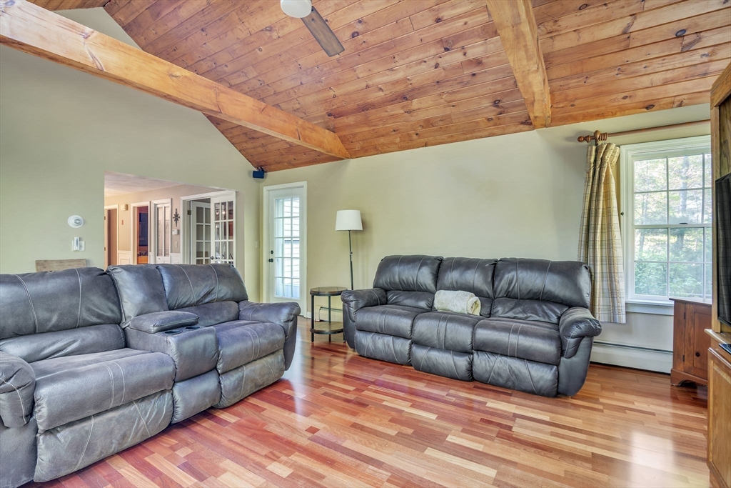 4 Stuart Road Rochester, MA 02770 - Photo 3 of 37 a living room with furniture a couch and wooden floor