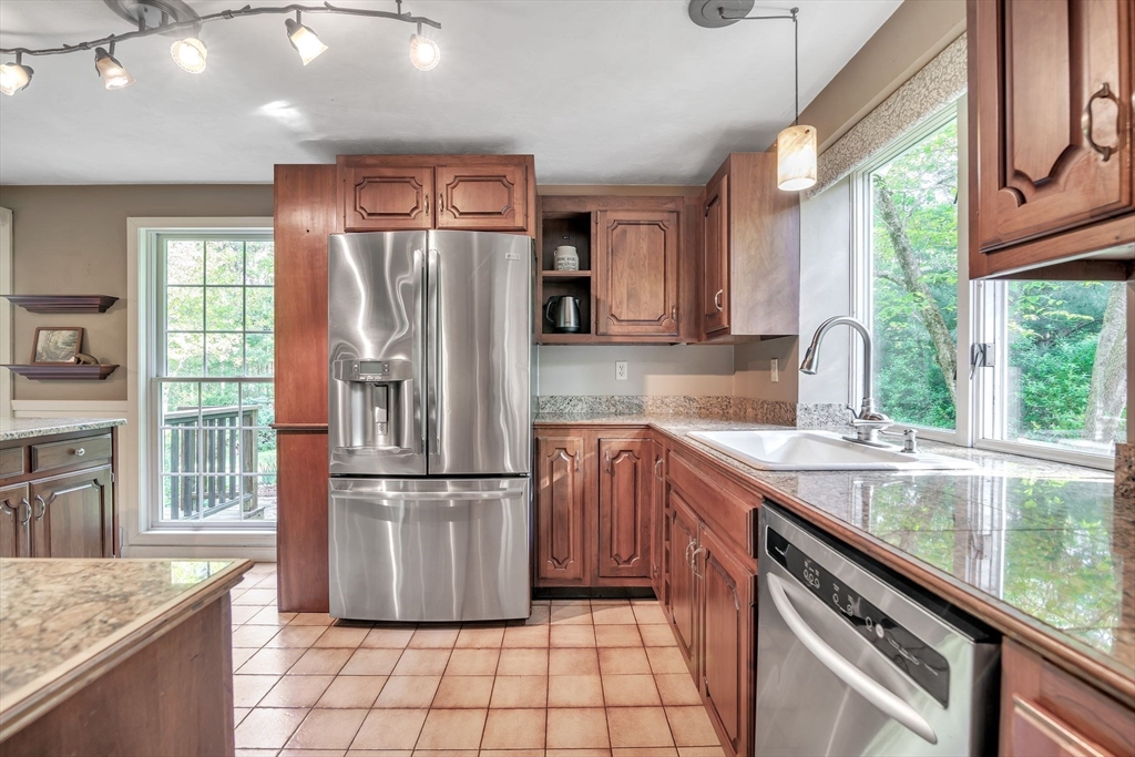 4 Stuart Road Rochester, MA 02770 - Photo 6 of 37 a kitchen with a sink a counter top space cabinets and stainless steel appliances