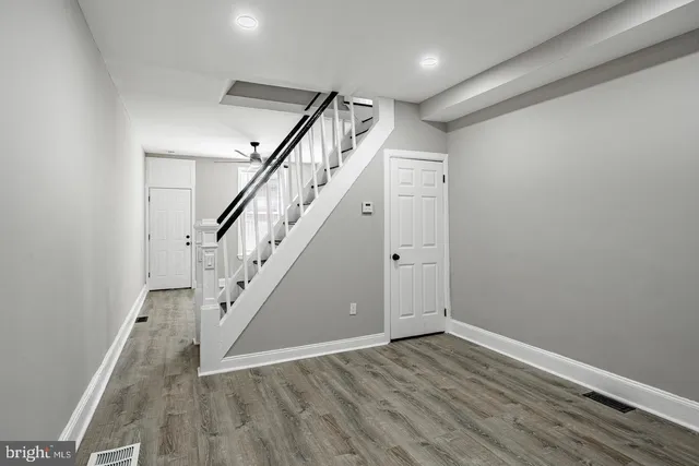 a view of entryway with wooden floor