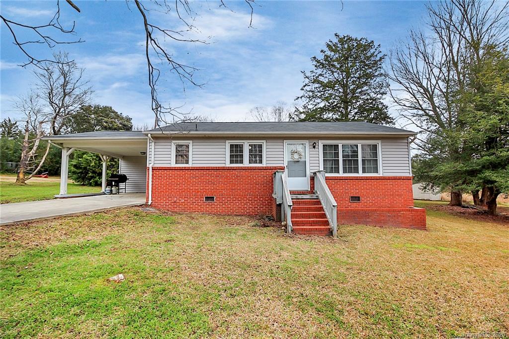 561 South Potter Road Lancaster, SC 29720 - Photo 1 of 33 a backyard of a house with wooden fence and large trees