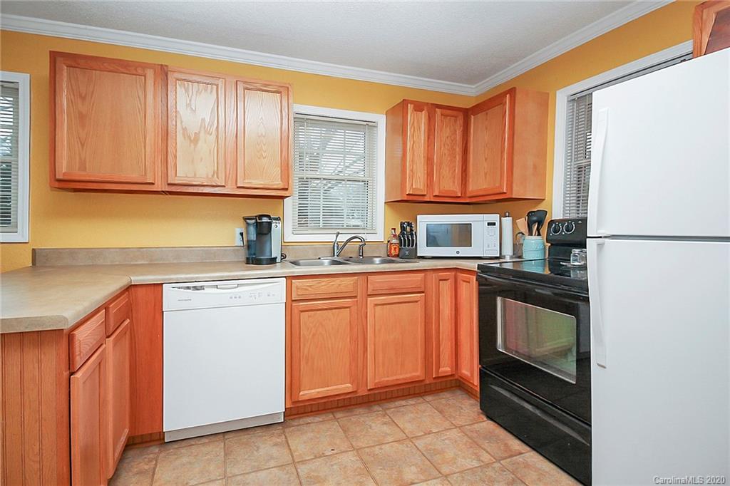 561 South Potter Road Lancaster, SC 29720 - Photo 13 of 33 a kitchen with stainless steel appliances granite countertop a refrigerator sink and cabinets
