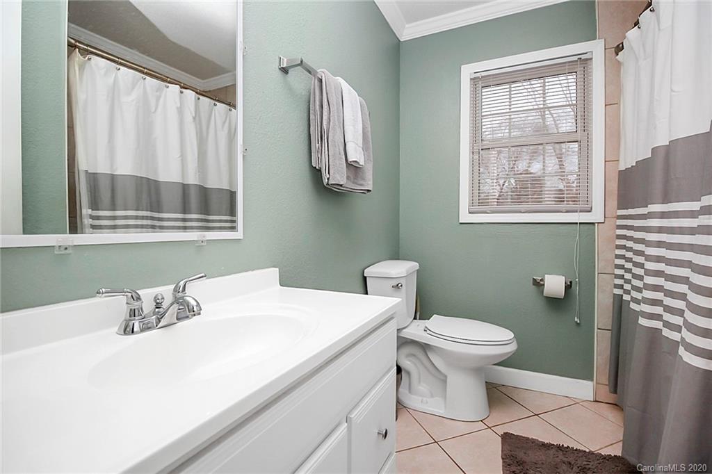 561 South Potter Road Lancaster, SC 29720 - Photo 18 of 33 a bathroom with a sink toilet and window