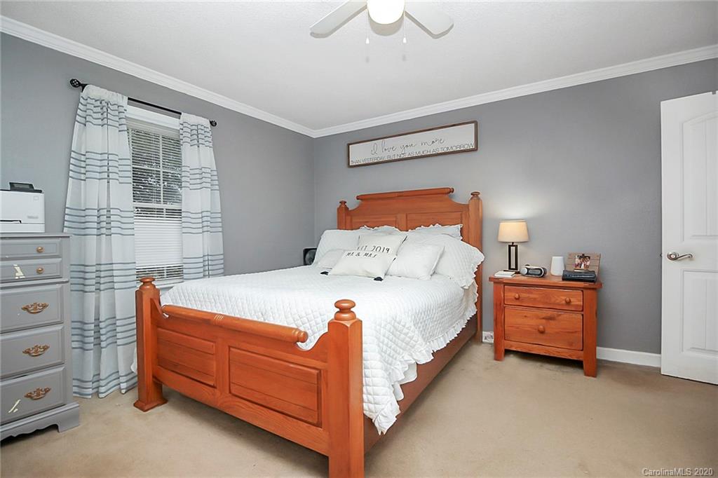 561 South Potter Road Lancaster, SC 29720 - Photo 20 of 33 a bed room with a bed and a dresser