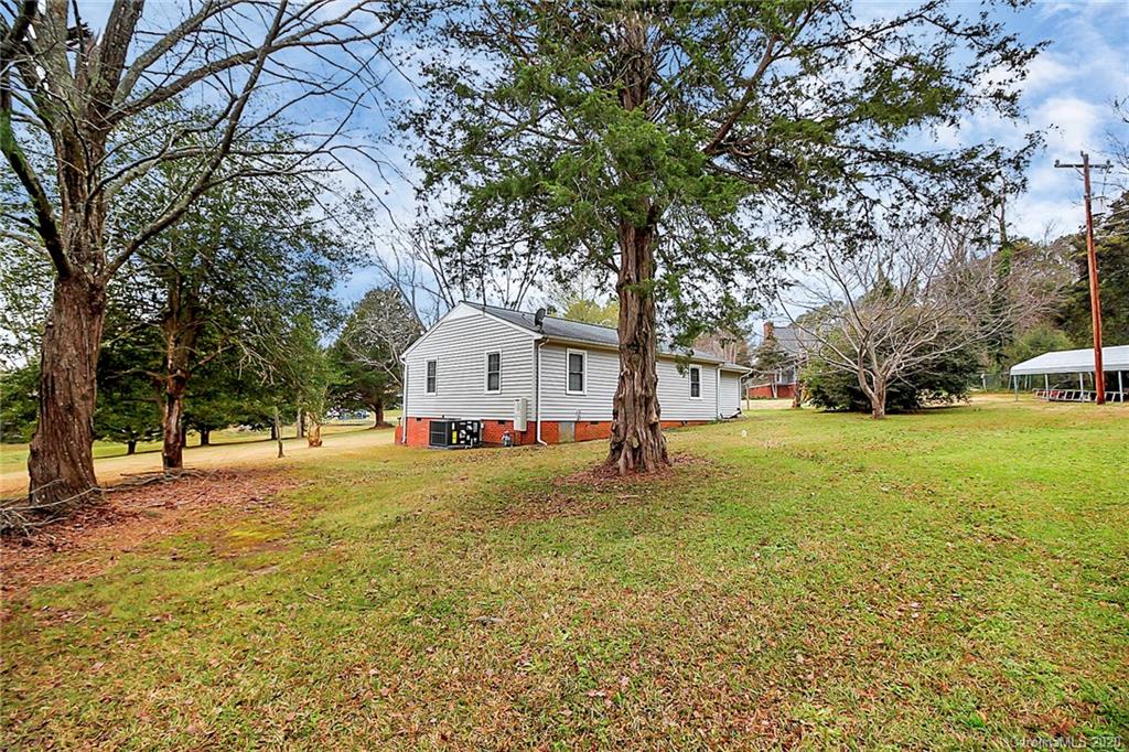 561 South Potter Road Lancaster, SC 29720 - Photo 25 of 33 a view of a yard with a house and large trees
