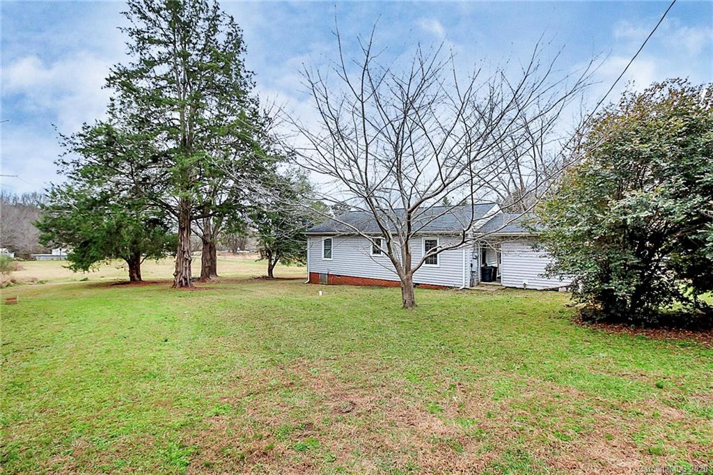 561 South Potter Road Lancaster, SC 29720 - Photo 26 of 33 a view of a yard with a house and a large tree