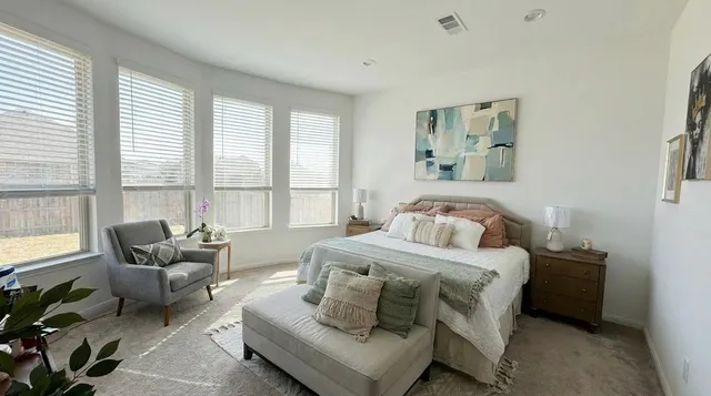a bathroom with a sink a mirror and a shower