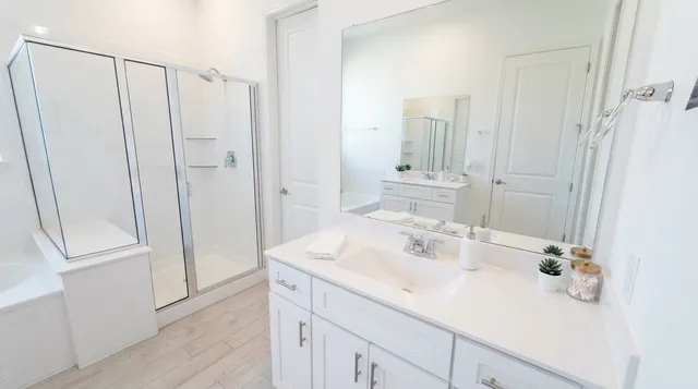 a bathroom with a double vanity sink and a mirror