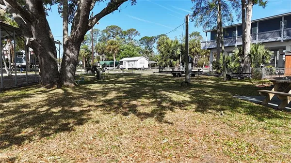a view of a park with swings and a yard