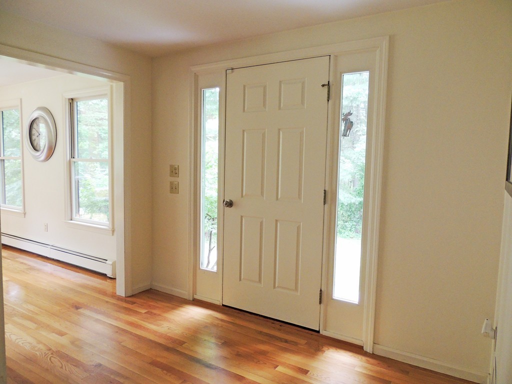 61 Judy Farm Road Carlisle, MA 01741 - Photo 12 of 24 an empty room with wooden floor and windows