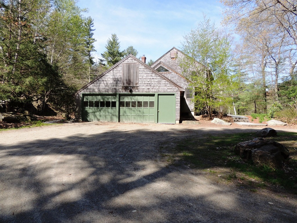 61 Judy Farm Road Carlisle, MA 01741 - Photo 17 of 24 a front view of a house with a yard