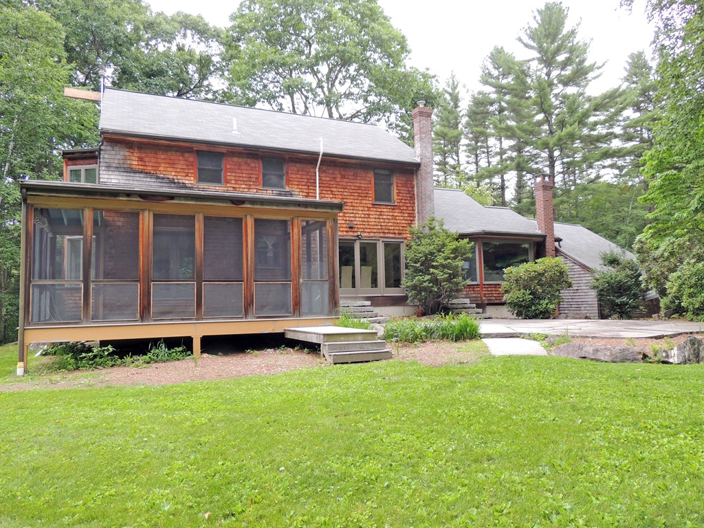 61 Judy Farm Road Carlisle, MA 01741 - Photo 19 of 24 a front view of a house with a yard