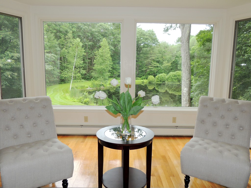 61 Judy Farm Road Carlisle, MA 01741 - Photo 2 of 24 a view of a living room with furniture and a large window