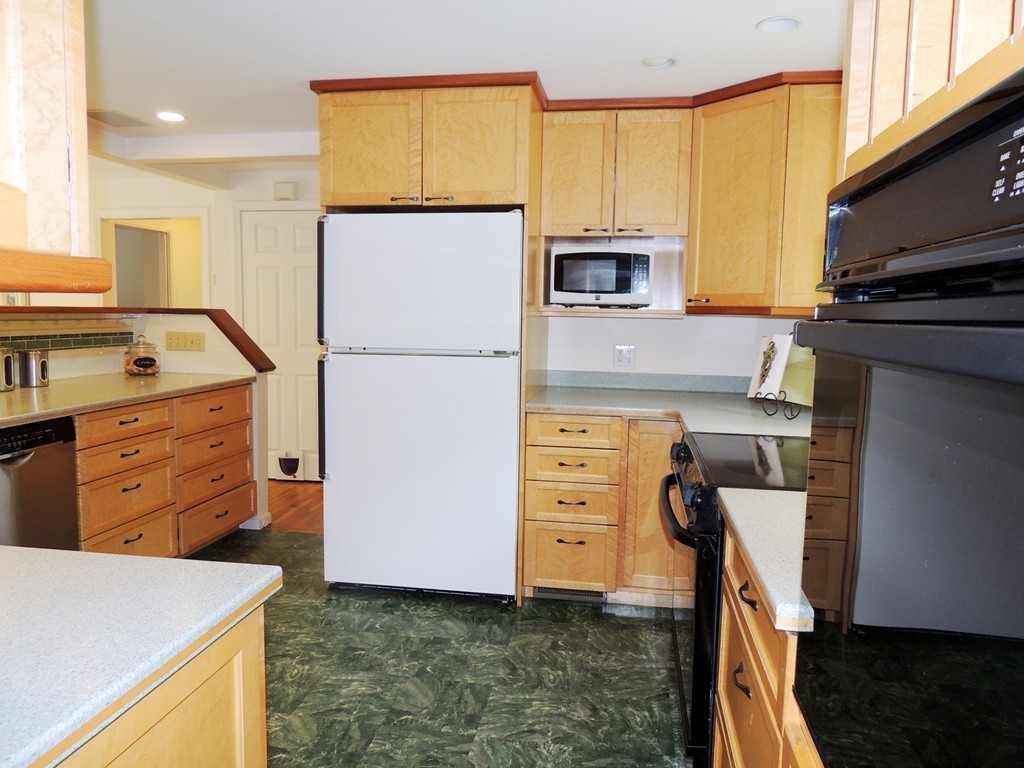 61 Judy Farm Road Carlisle, MA 01741 - Photo 8 of 24 a kitchen with cabinets appliances and a window