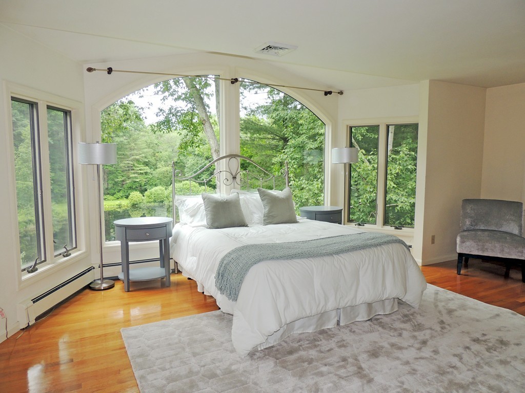 61 Judy Farm Road Carlisle, MA 01741 - Photo 9 of 24 a bed sitting in a bedroom next to a window