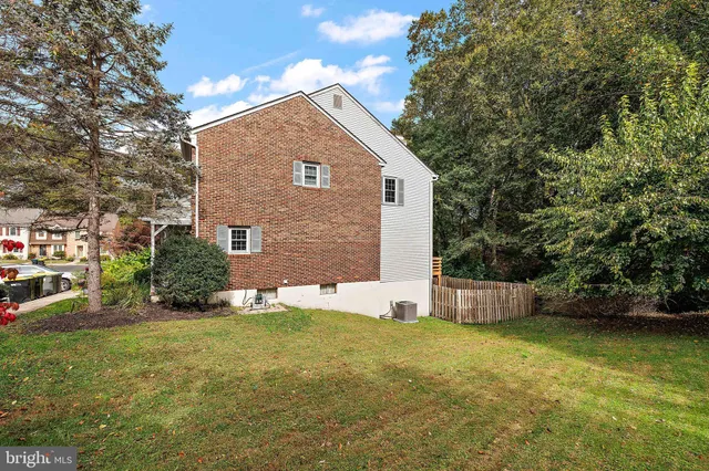 a view of a house with a yard and garage