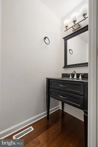 a view of a dresser with wooden floor