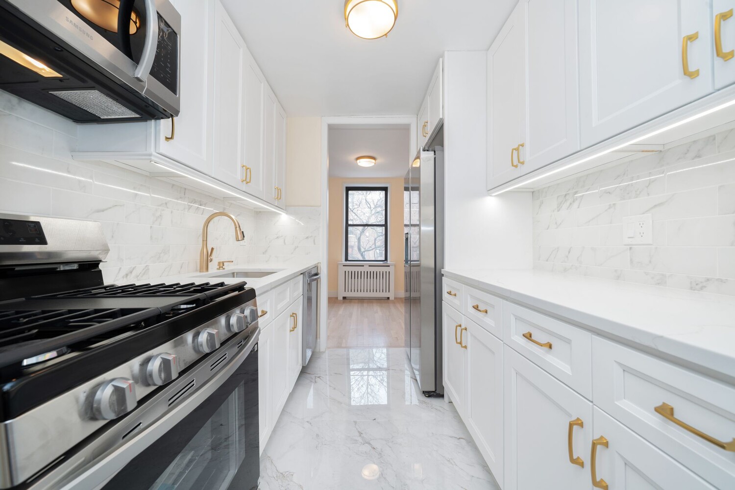 35-20 Leverich Street, Unit A403 Queens, NY 11372 - Photo 4 of 12 a kitchen with granite countertop a stove and a granite top