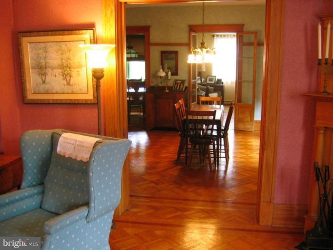 209 Hawthorn Road Baltimore, MD 21210 - Photo 14 of 28 a dining room with furniture window and wooden floor