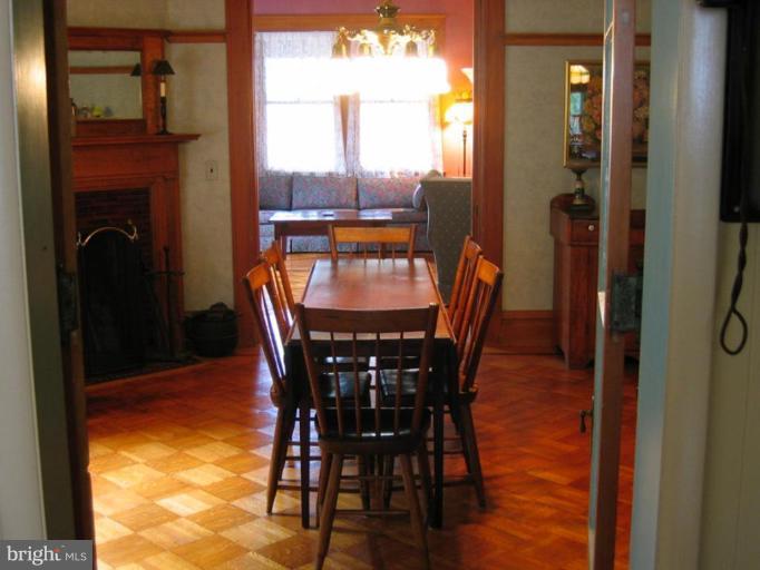 209 Hawthorn Road Baltimore, MD 21210 - Photo 16 of 28 a view of a dining room with furniture window and wooden floor