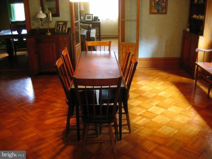 209 Hawthorn Road Baltimore, MD 21210 - Photo 18 of 28 a dining room with furniture and wooden floor