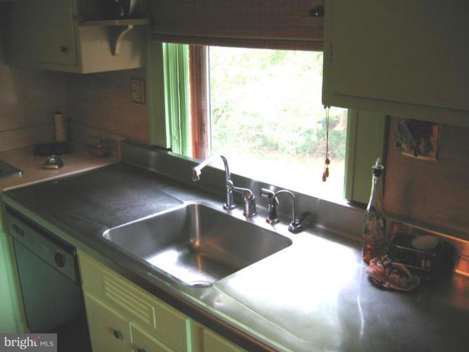 209 Hawthorn Road Baltimore, MD 21210 - Photo 20 of 28 a kitchen with a sink and a large window