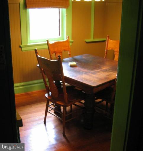 209 Hawthorn Road Baltimore, MD 21210 - Photo 22 of 28 a view of a dining room with furniture and a window