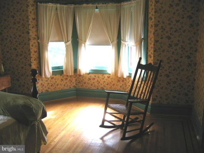 209 Hawthorn Road Baltimore, MD 21210 - Photo 24 of 28 a view of a room with a chairs and table in a room