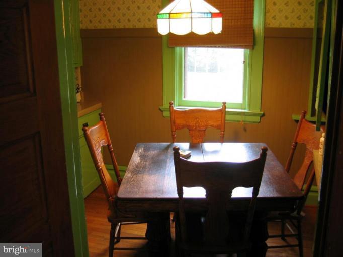 209 Hawthorn Road Baltimore, MD 21210 - Photo 26 of 28 a view of a dining room with furniture and window