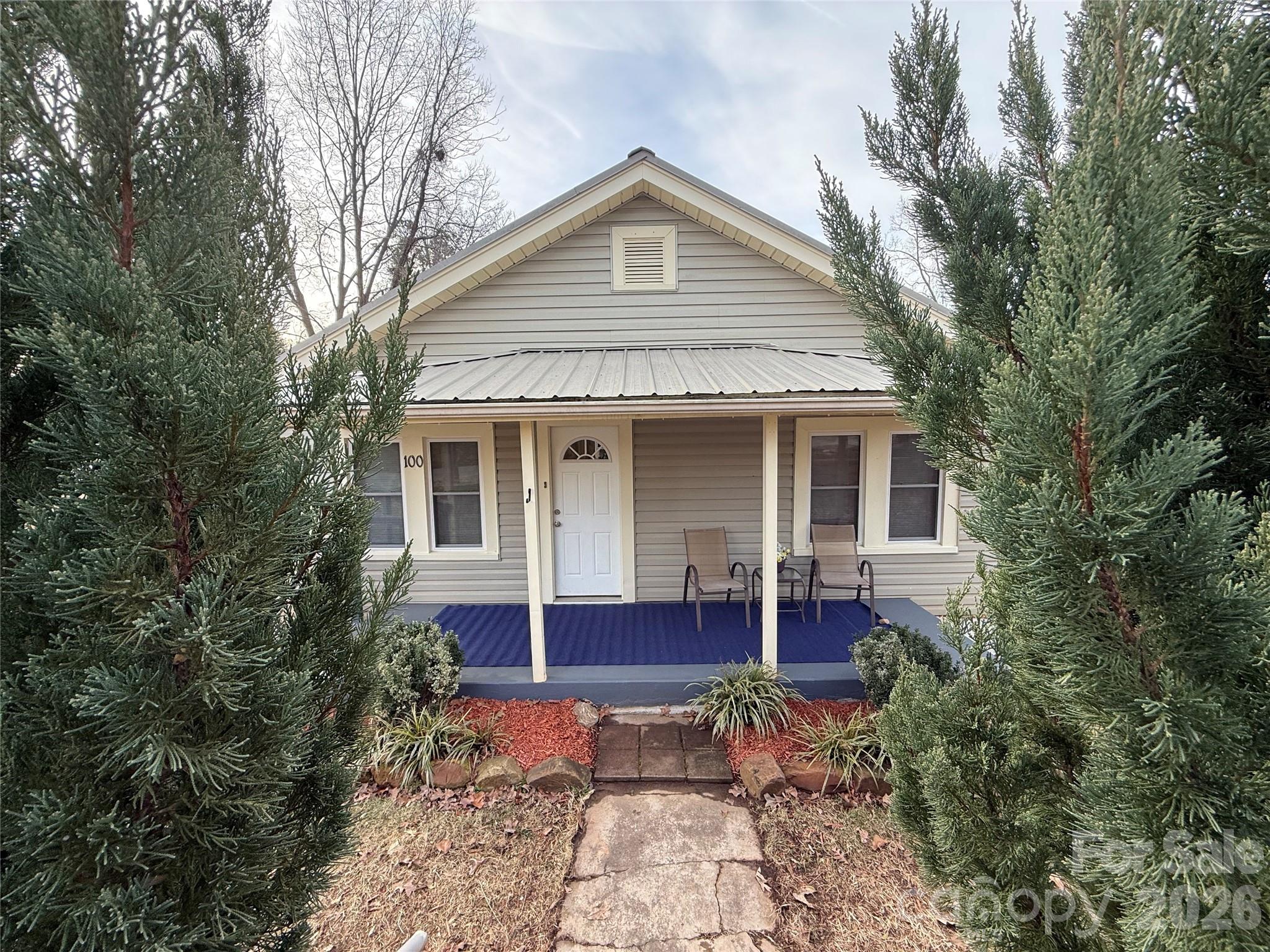 100 Perry Street Marion, NC 28752 - Photo 1 of 20 a front view of house with yard outdoor seating and barbeque oven