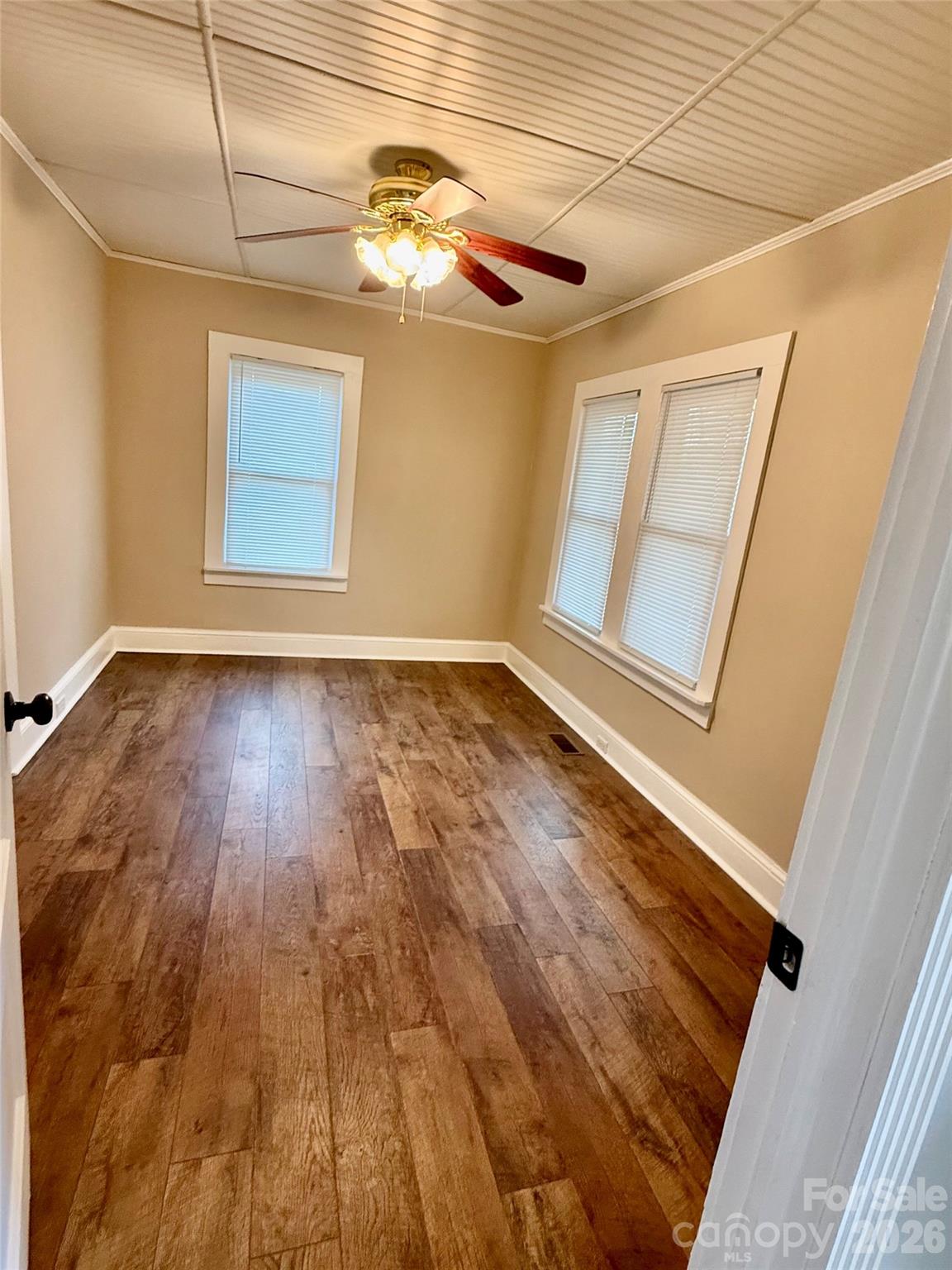 100 Perry Street Marion, NC 28752 - Photo 13 of 20 a view of empty room with wooden floor