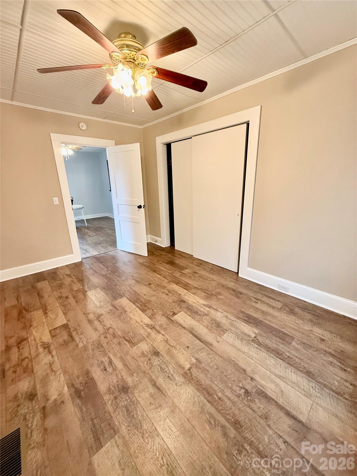 100 Perry Street Marion, NC 28752 - Photo 14 of 20 a view of a big room with closet and ceiling fan