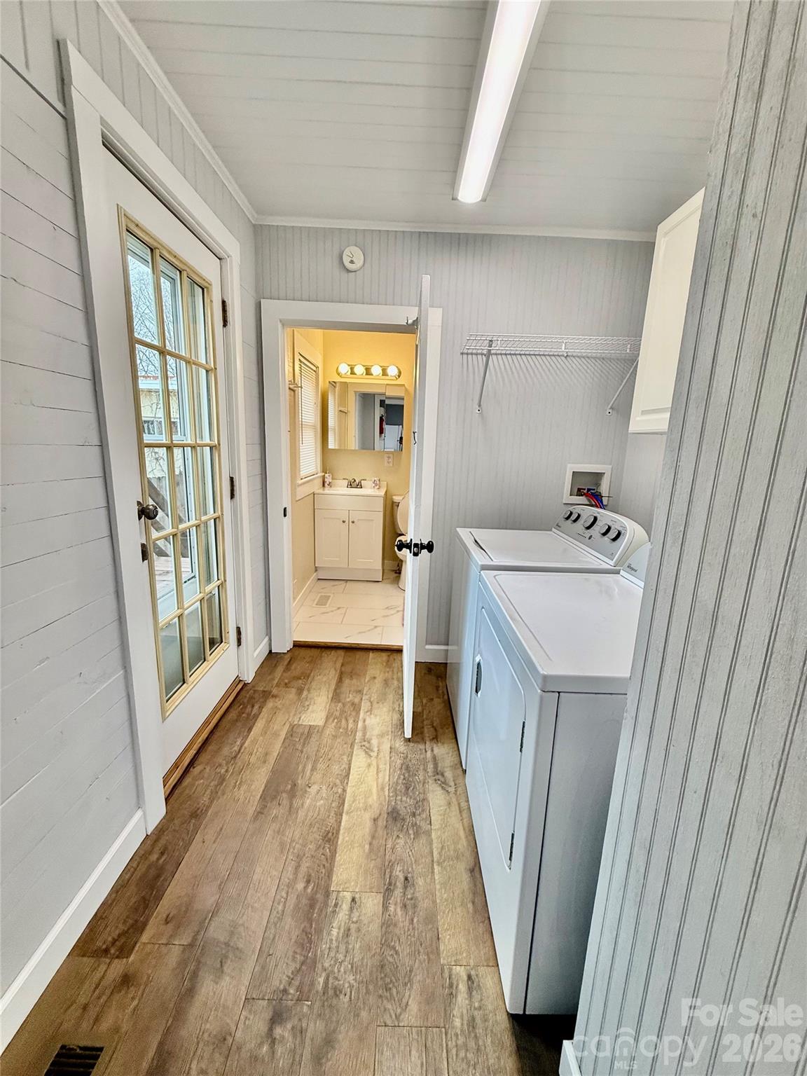 100 Perry Street Marion, NC 28752 - Photo 15 of 20 a bathroom with a sink a large mirror and a bathtub