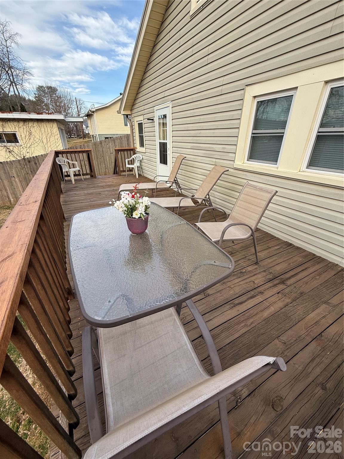 100 Perry Street Marion, NC 28752 - Photo 18 of 20 a roof deck with couch and chairs