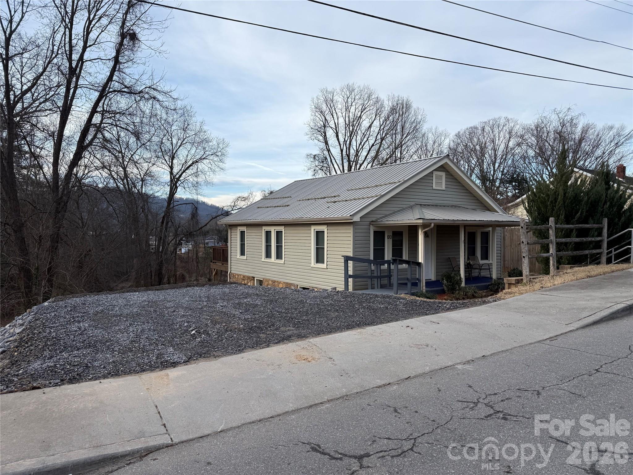 100 Perry Street Marion, NC 28752 - Photo 2 of 20 a front view of a house with a yard and garage