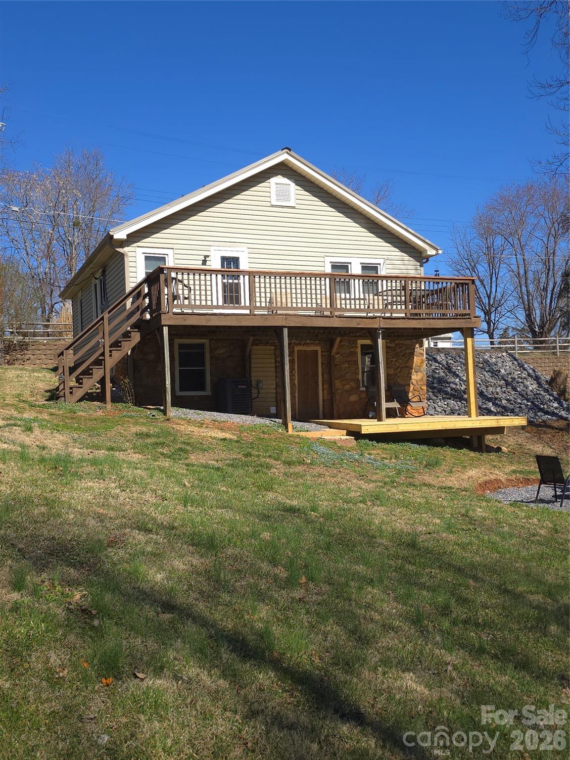 100 Perry Street Marion, NC 28752 - Photo 7 of 20 a view of a house with a garden and yard