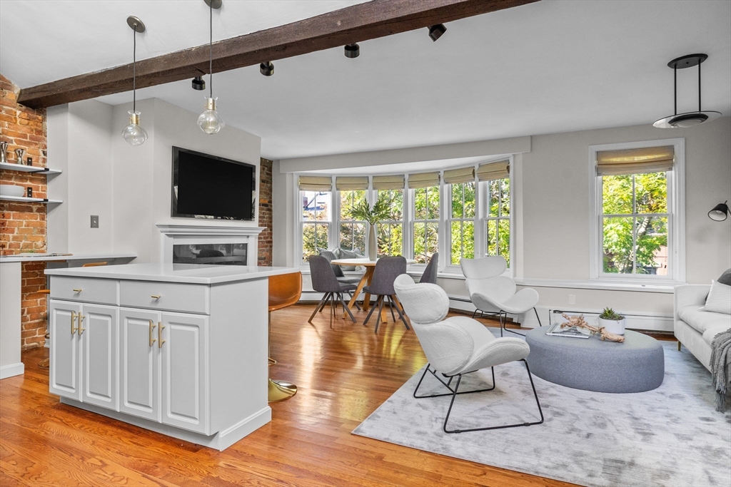 81 Waltham Street, Unit 6 Boston, MA 02118 - Photo 1 of 24 a living room with furniture and a flat screen tv