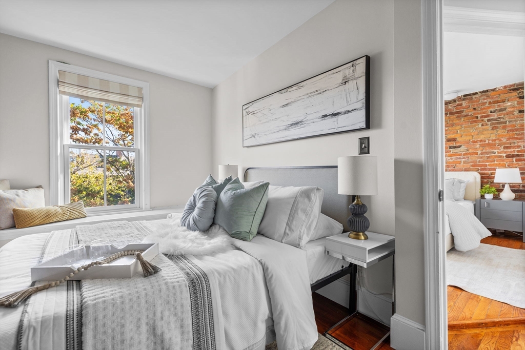 81 Waltham Street, Unit 6 Boston, MA 02118 - Photo 18 of 24 a bedroom with a bed and window