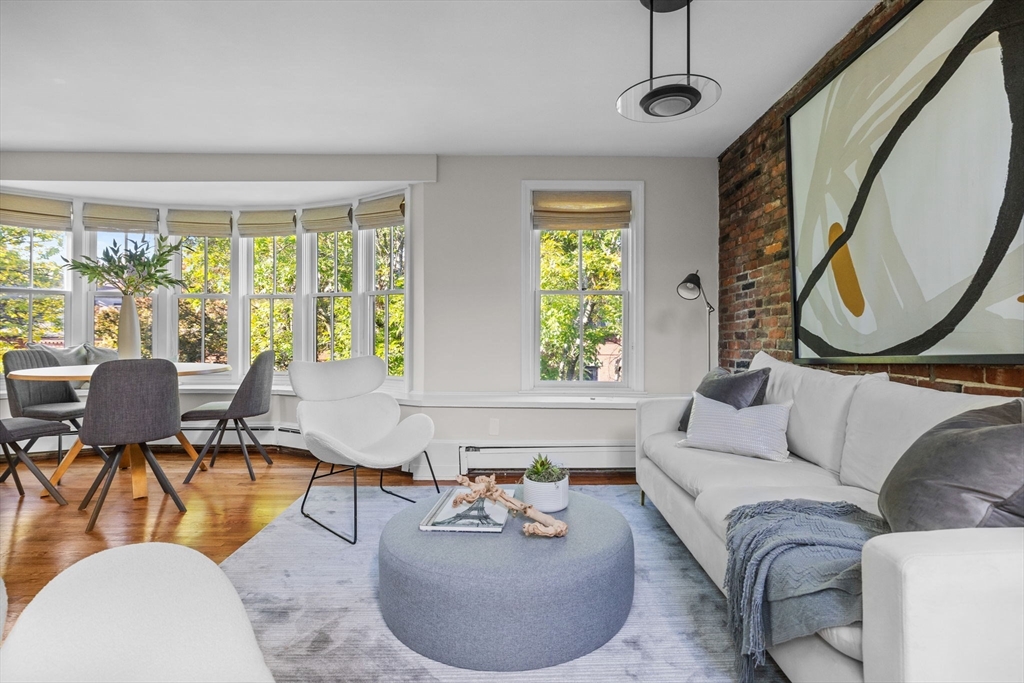 81 Waltham Street, Unit 6 Boston, MA 02118 - Photo 4 of 24 a living room with furniture and a large window