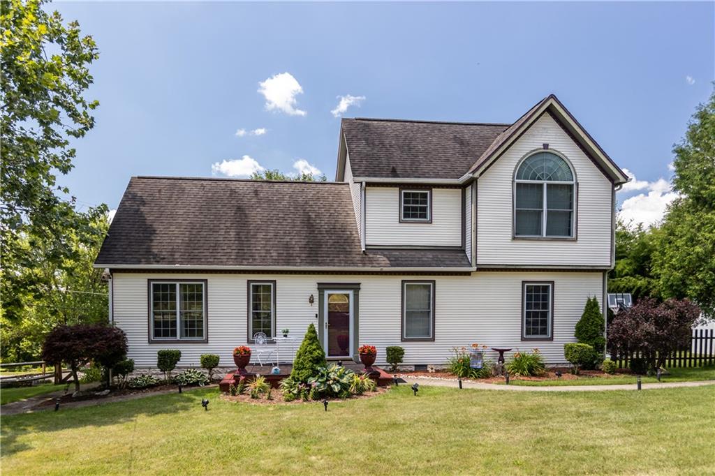 1701 Darlington Road Beaver Falls, PA 15010 - Photo 1 of 30 a front view of a house with a yard and swimming pool