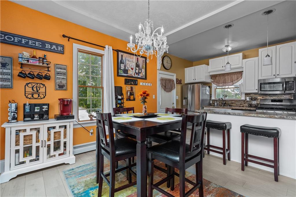 1701 Darlington Road Beaver Falls, PA 15010 - Photo 11 of 30 a view of a dining room with furniture window and wooden floor